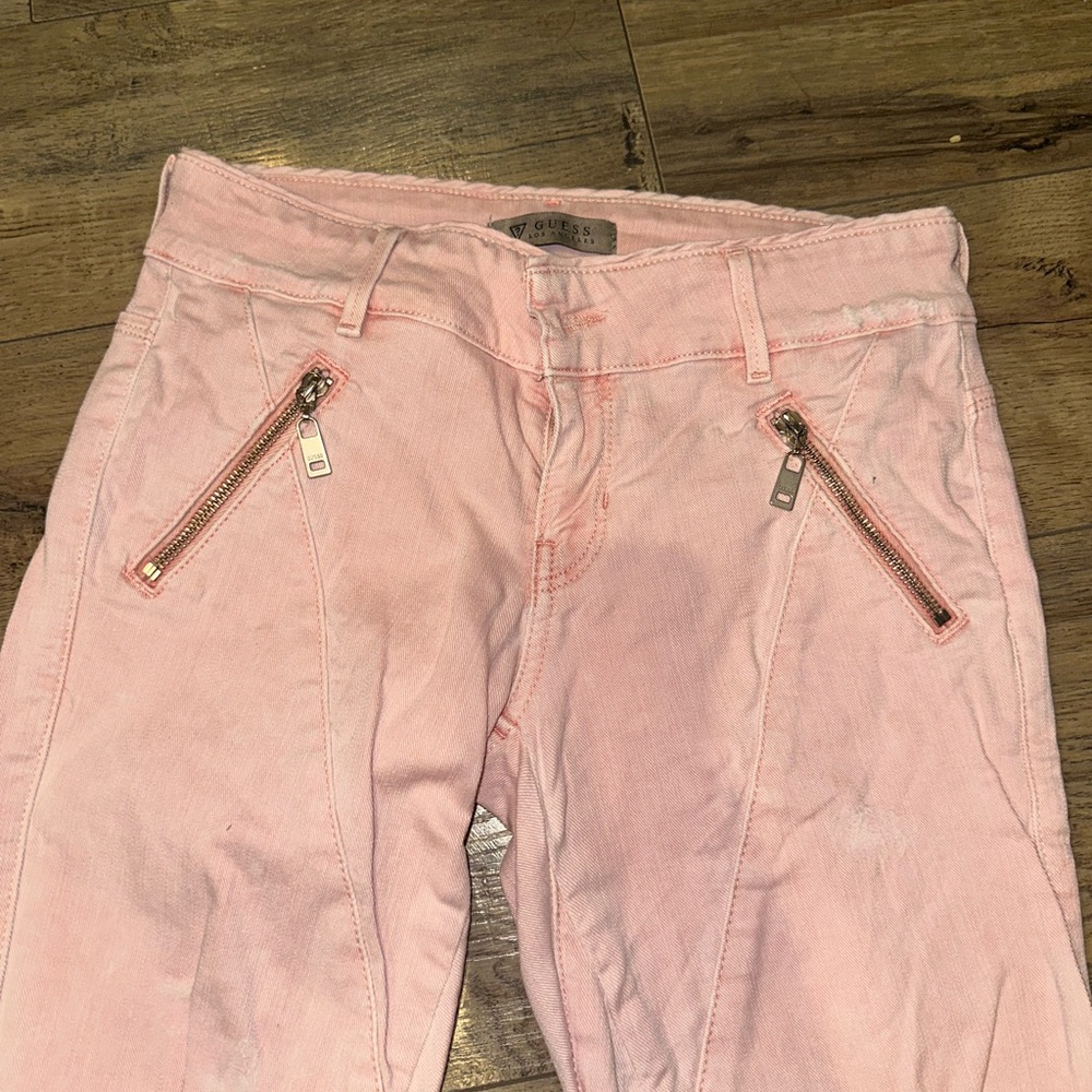 Pink ripped moto zip jeans